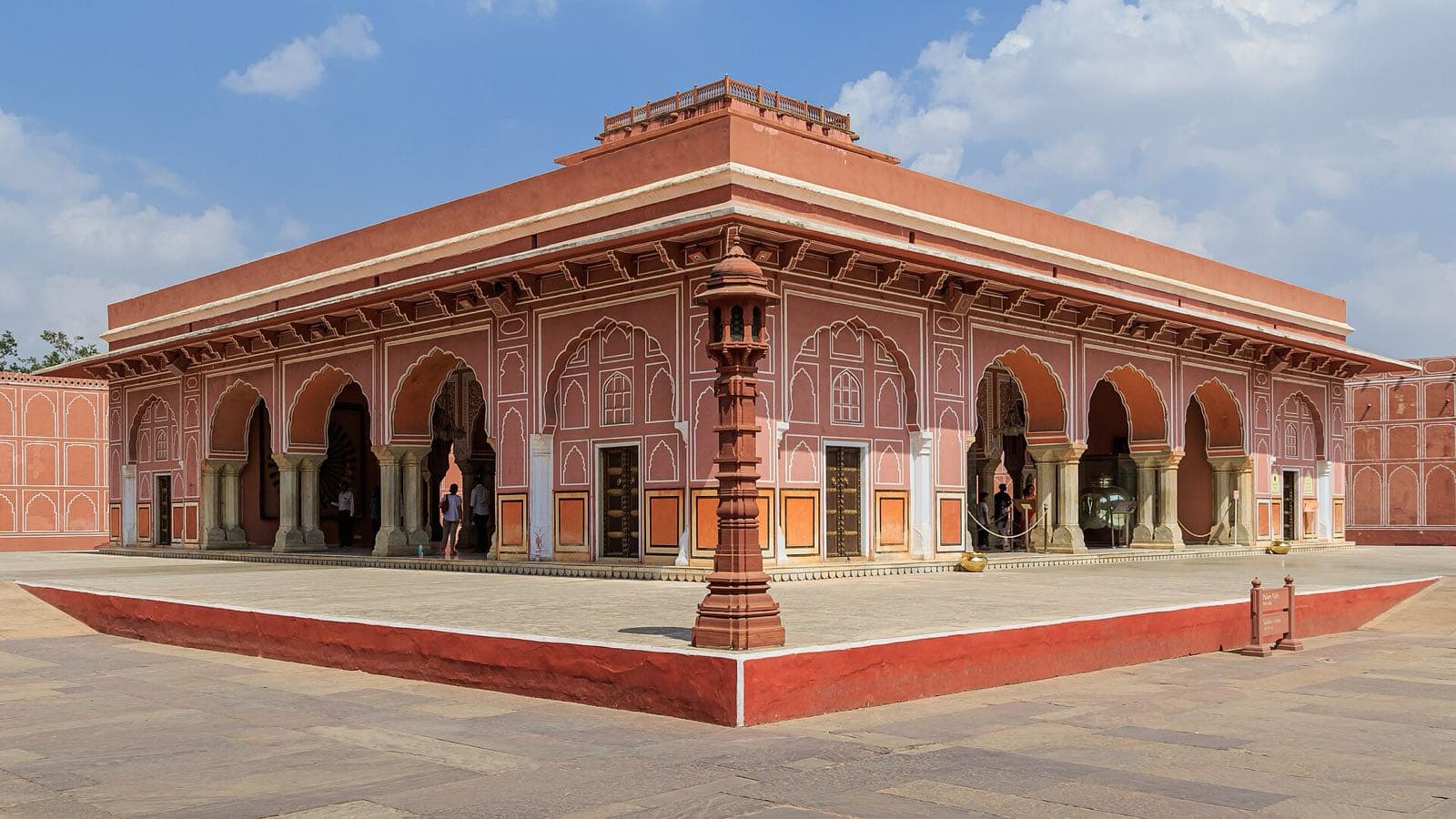 The arcaded pink pavilion of the Diwan-i-Khas, the hall of private audience, in the City Palace courtyard.